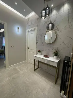 a room with a mirror and a table with plants at 2Effe apartment in Rome