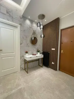 a bathroom with a table and a mirror and a door at 2Effe apartment in Rome