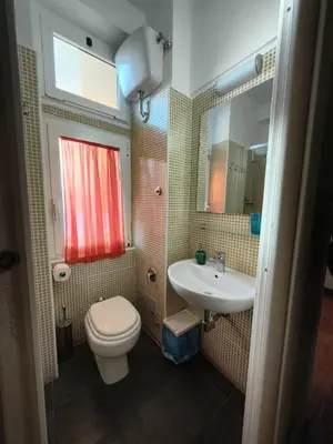 a bathroom with a toilet and a sink at Gregory B&B Vatican in Rome