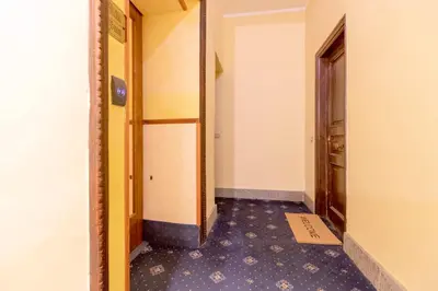 a corridor of a room with a door and a floor at Tiny Steps to Piazza di Spagna in Rome