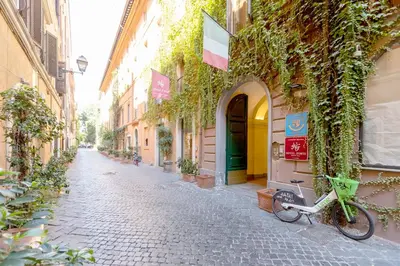 a bike parked on a street next to a building at Tiny Steps to Piazza di Spagna in Rome
