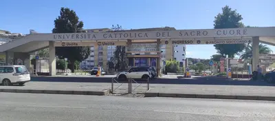 a gas station with a car parked in front of it at Gemelli BnB Guest House in Rome