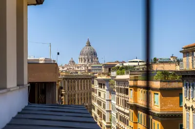 a view of the capitol building from the roofs of buildings at Belli Vatican Attico - Luxury Design Rooftop Apartment close to Vatican City in Rome