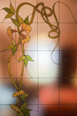 a stained glass window with a plant at L'Ottavo Re di Roma in Rome