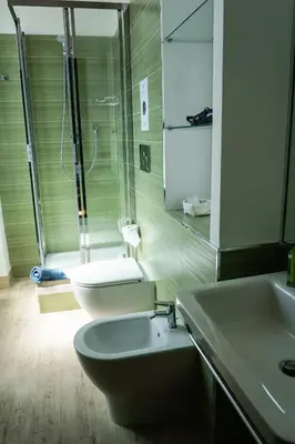 a bathroom with a toilet and a sink and a shower at L'Ottavo Re di Roma in Rome
