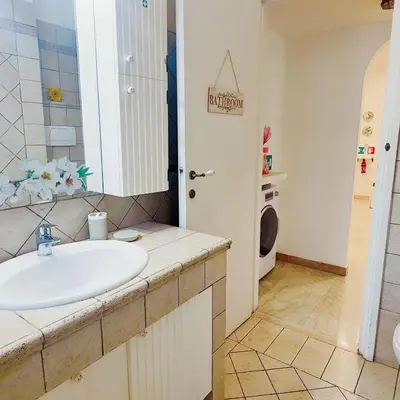 a bathroom with a sink and a toilet at Roma For You - Apartment - Metro B in Rome