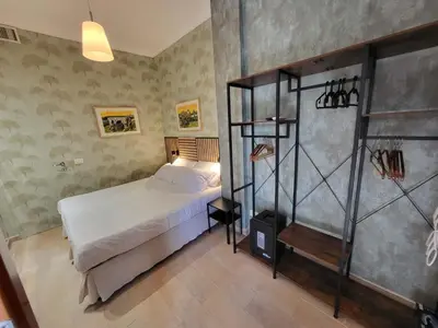 a bedroom with a bed and a shower in it at Venus Inn Casa Vacanze AURELIA ANTICA in Rome