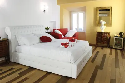 a white couch with two dogs on it in a room at Hub Navona in Rome