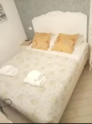 a bedroom with two beds with towels on them at PANTHEON APARTMENT in the Heart of Rome in Rome