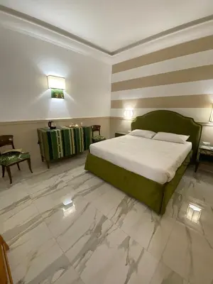 a bedroom with a large bed and a marble floor at Cozy Luxury Room Pantheon in Rome