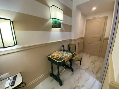 a bathroom with a table and a mirror at Cozy Luxury Room Pantheon in Rome