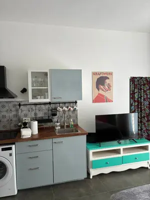 a kitchen with a sink and a microwave at nel cuore di trastevere in Rome