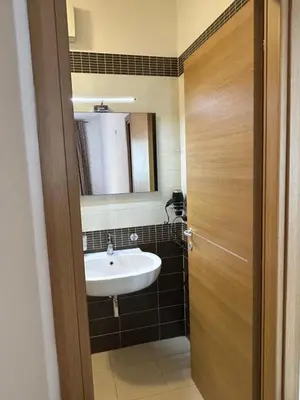 a bathroom with a sink and a mirror at Dina Suite Rome in Rome