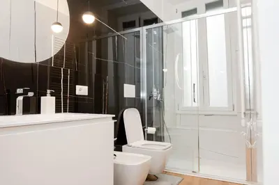 a bedroom with a bed with towels on it at Casa Vacanze Roma in Rome