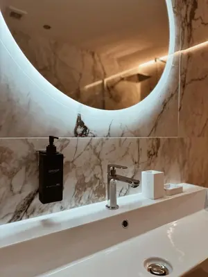 a bathroom with a sink and a mirror at Residenza Imperiale - Luxury Guest House in Rome