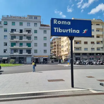 a blue street sign on the side of a street at Suite Station Tiburtina in Rome