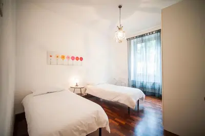 a bedroom with two beds and a window at Great Apartment in great Location in Rome