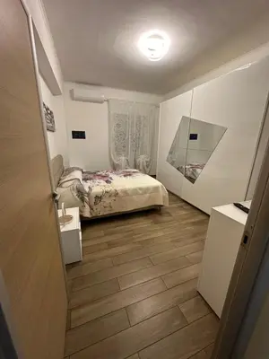 a small bedroom with a bed and a window at Roma nel Mondo in Rome