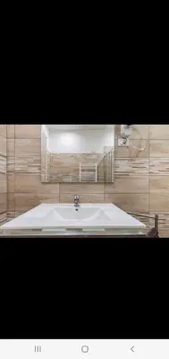 a bathroom with a white tub and a sink at Cuore Di Roma Holidays in Rome