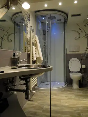 a bathroom with a shower and a sink and a toilet at Jazz Style Home in Rome