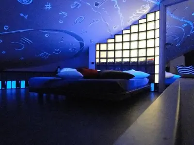 a bedroom with a bed with a blue ceiling at Jazz Style Home in Rome
