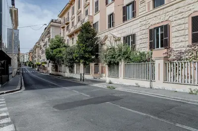 an empty street in a city with buildings at a casa di Manuela luxury apartment in Rome