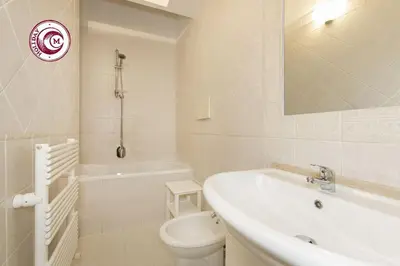 a bathroom with a sink and a tub and a toilet at C M La Terrasse di Monti in Rome