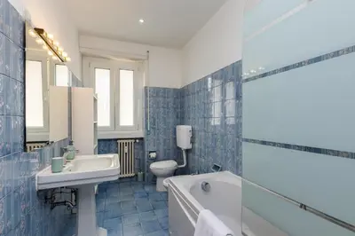 a bathroom with a sink and a tub and a toilet at Presidential Vatican Palace II in Rome