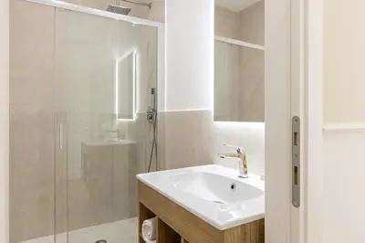 a bathroom with a sink and a shower at Risorgimento 9 - Guest House in Rome