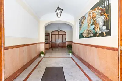 a hallway with a large painting on the wall at Risorgimento 9 - Guest House in Rome