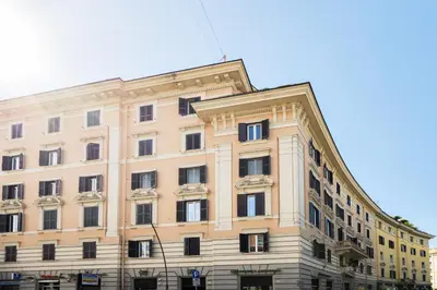 a large building with windows on the side of it at HC - Chez Le Roi Luxury Apartment in Rome