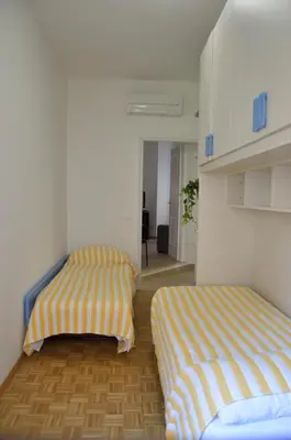 a room with two beds and a hallway at Apartment Veio in Rome