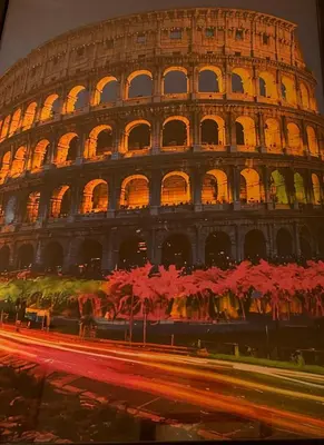 a view of the colosseum at night at ROMA Appia in Rome