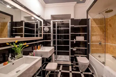 a bathroom with a sink and a tub and a shower at The Inn at the Spanish Steps Luxury Collection - The View in Rome