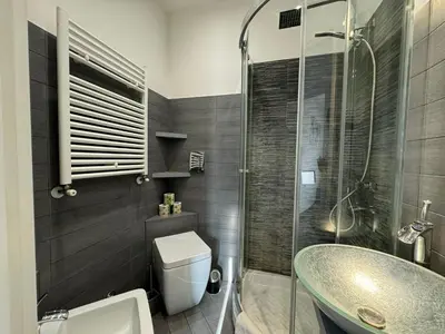 a bathroom with a sink and a toilet and a shower at G&G Apartment in Rome Quadraro in Rome