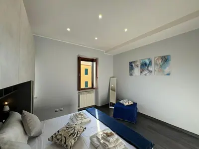 a large room with a bed and a window at G&G Apartment in Rome Quadraro in Rome