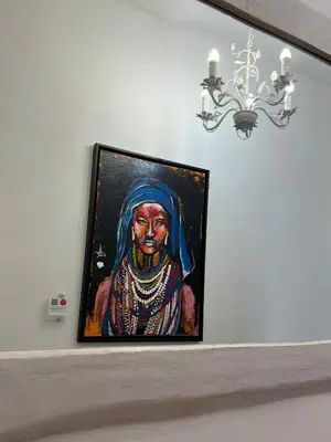 a painting of a woman on a shelf with a chandelier at Veniero Apartment in Rome