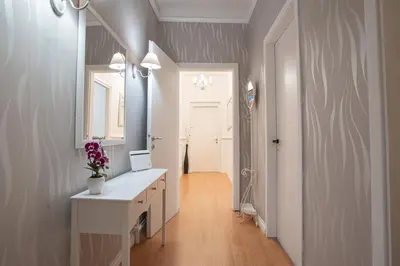 a bathroom with a white vanity and a mirror at Veniero Apartment in Rome