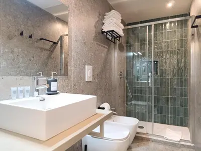 a bathroom with a sink and a toilet and a shower at HoneyComb GuestHouse in Rome
