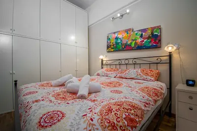 a bedroom with a bed with towels on it at House Serena in Rome