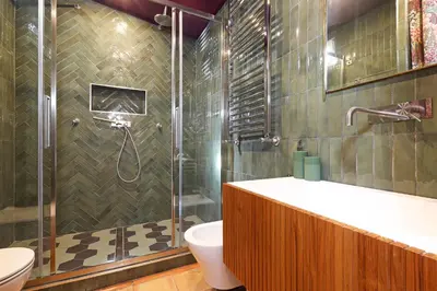 a bathroom with a shower and a toilet and a sink at Spagna Prestige Apartment in Rome