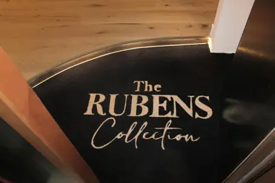 a sign that says the rulers collection on a door at The Rubens Collection in Rome
