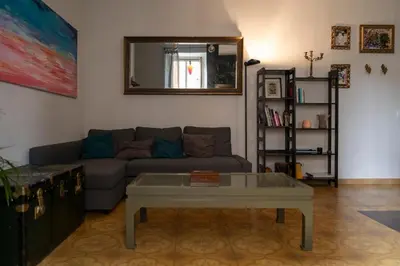 a living room with a couch and a table at Artist Vatican House in Rome