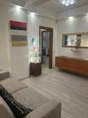 a living room with a couch and a mirror at TopVaticanApartment in Rome