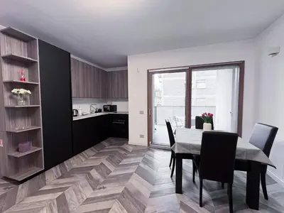 a kitchen and dining room with a table and chairs at F House Trastevere in Rome