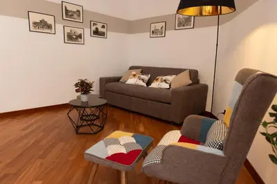 a living room with a couch and two chairs at Marisa lovely house in Rome