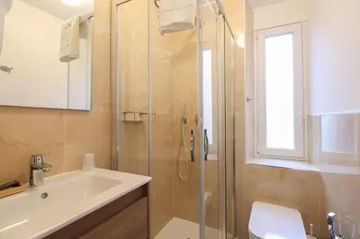 a bathroom with a shower and a sink and a toilet at Re Di Rhome Guest House in Rome