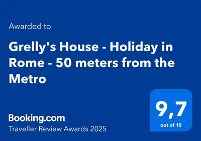 a table with a blue vase with flowers on it at GrElly's House - Holiday in Rome - 50 meters from the Metro in Rome