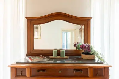a mirror on top of a dresser in a room at iFlat Trevi's Paradise in Rome