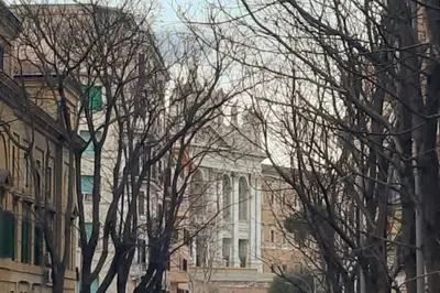 a white building with trees in front of it at CasaFaleria in Rome